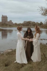 pagan wedding ceremony in front of a lake and castle