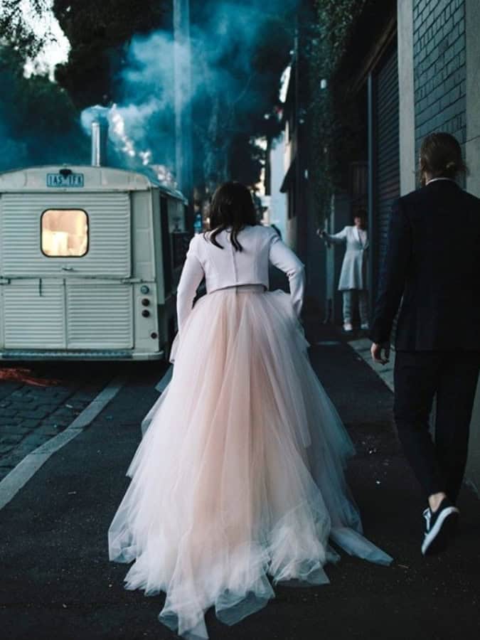 bride and groom outside winter wedding food truck