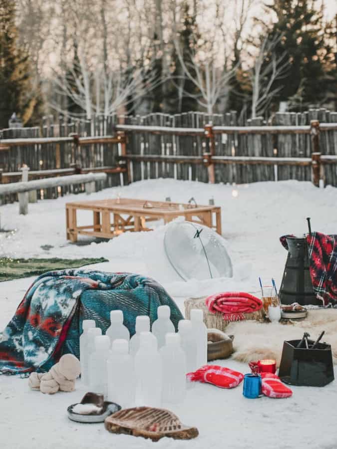 games set up in snow at winter wedding