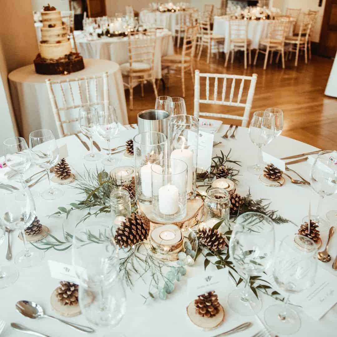table setting with pine cone decor