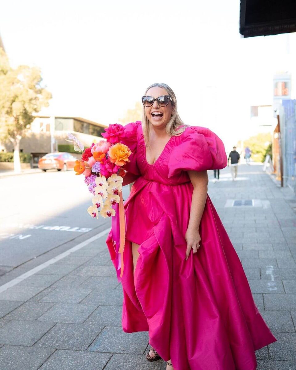bride in bright pink wedding dress, styling with sunglasses, bright bouquet no accessories 
