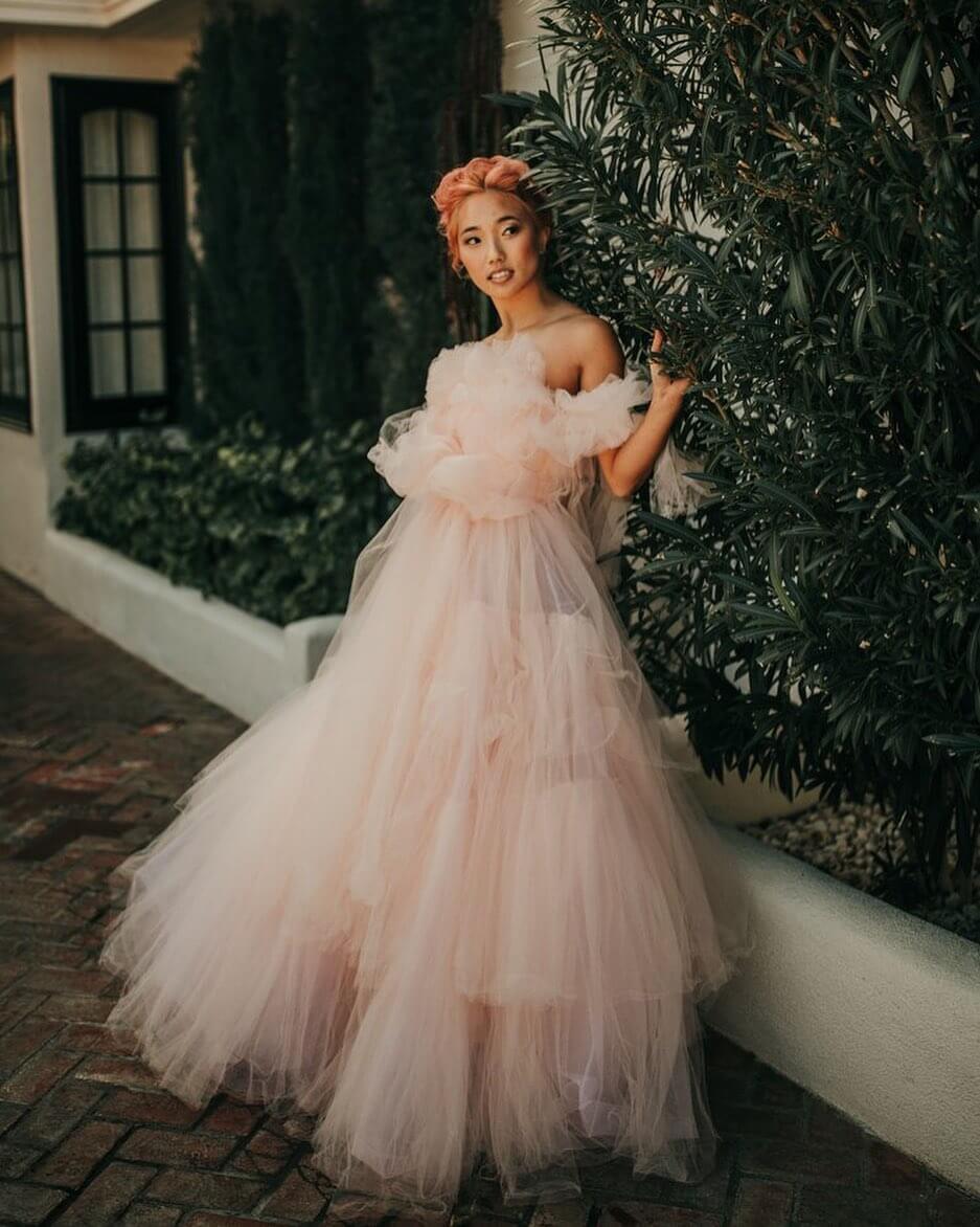 bride in puffy pink wedding dress, hair up and no accessories 