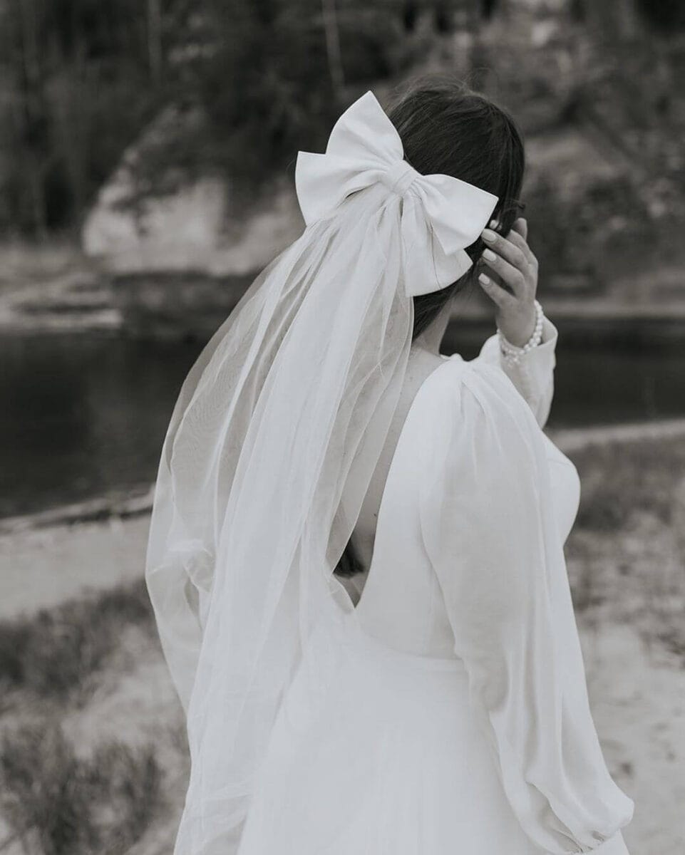 bride in veil with bow attached 