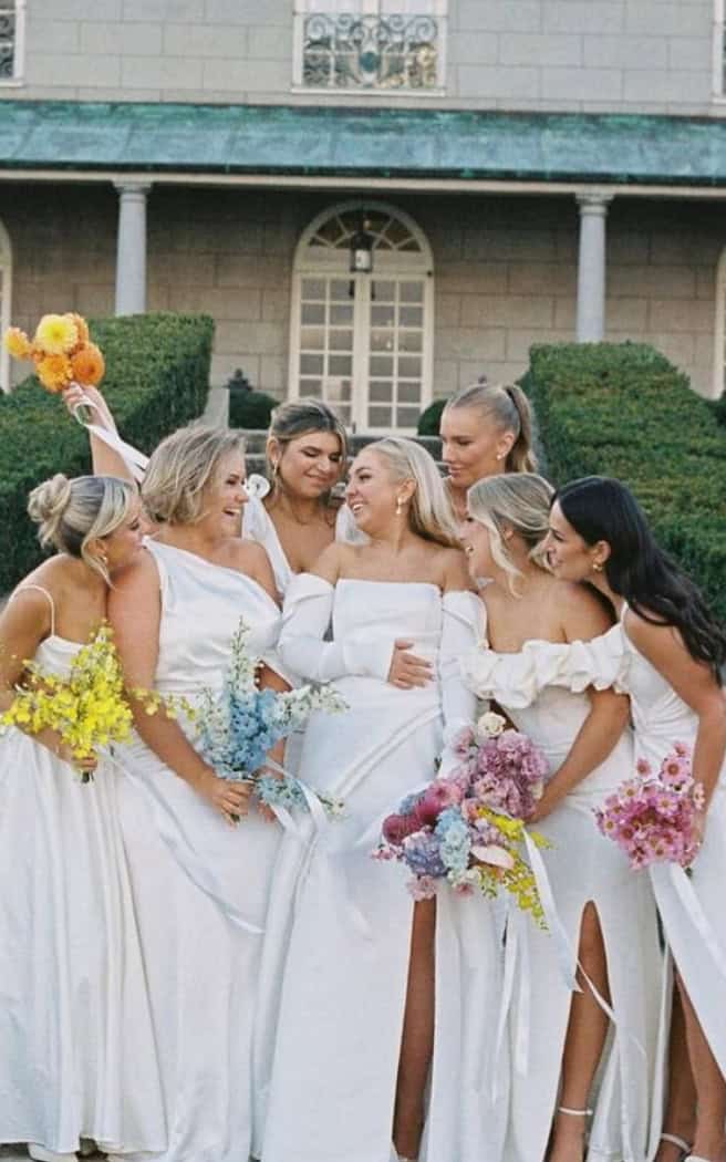 bride with bridesmaid with single flower bouquets