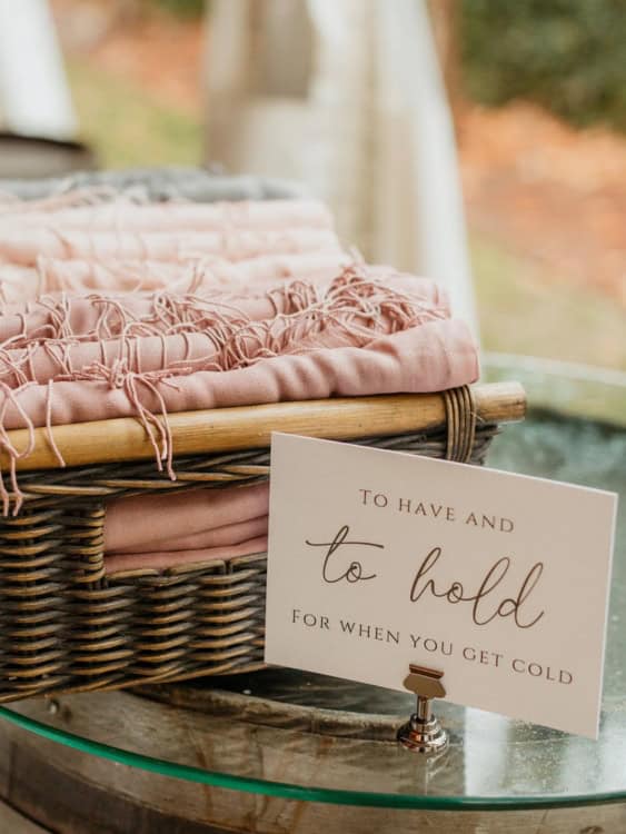 a basket of blankets with a sign saying to have and to hold