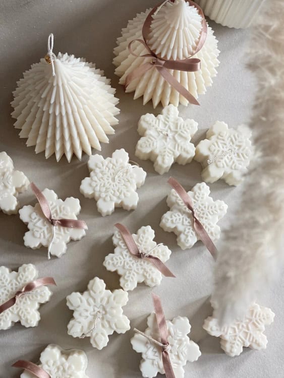 white snowflake shaped candles