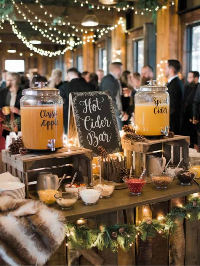 cider bar set up at a winter wedding reception 