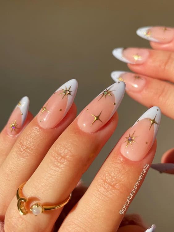 almond-shaped nails with a soft blush-pink base and white French tips. 