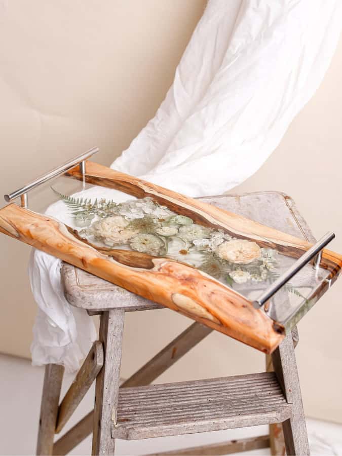 preserved wedding flowers in a resin and wood serving tray with handles