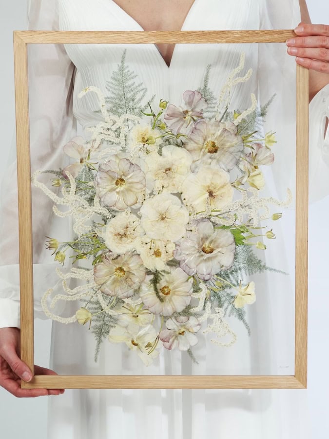 pressed white wedding bouquet in glass frame