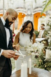 couple lighting their unity ceremony candle