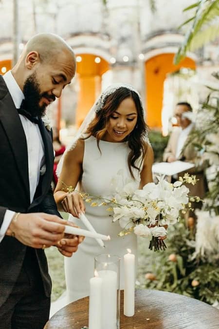 couple lighting their unity ceremony candle