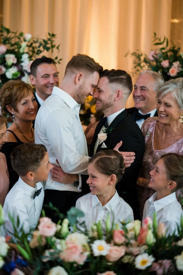 ceremony photo of a blended family all togther smiling